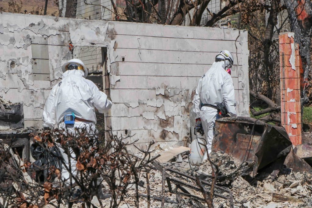 EPA workers finding many batteries during  hazardous material cleanup of Lahaina burned area